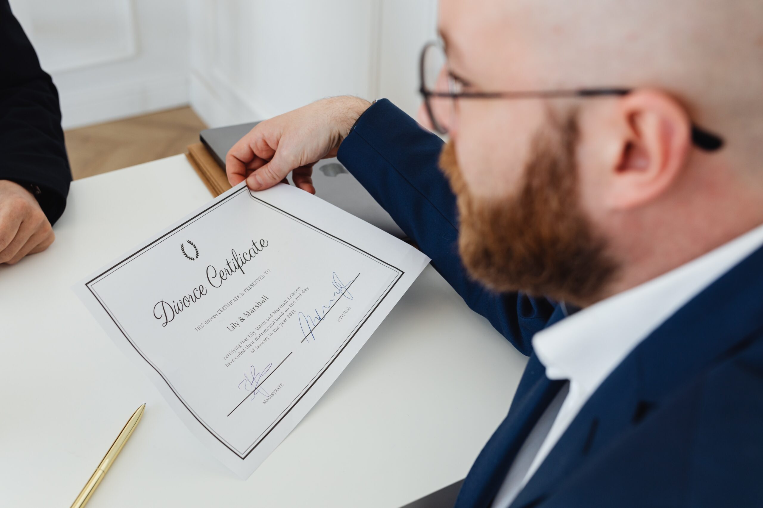 a man holding a divorce certificate
